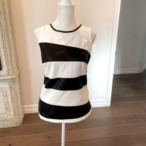 Very cute! INC size small, white and leather sleeveless top!